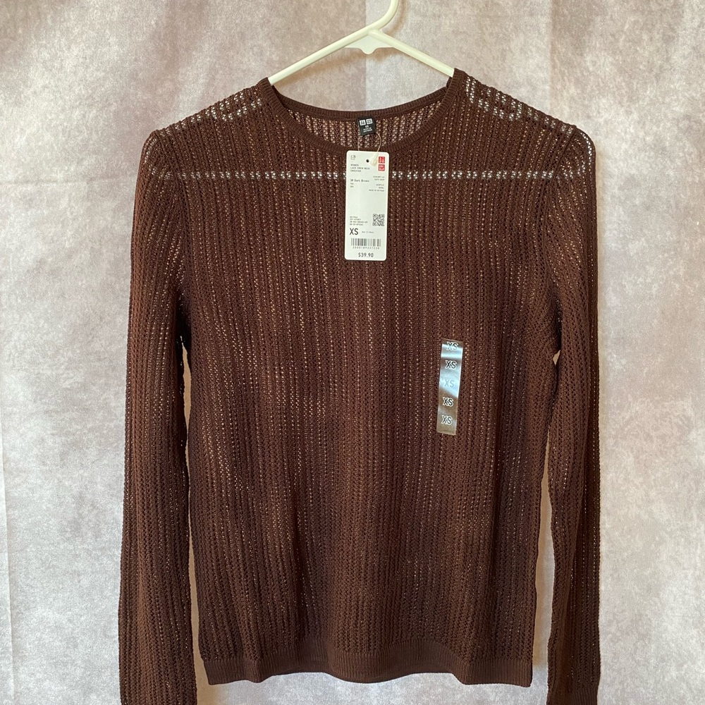 A fitted lace sweater: elegant, cozy feel — and great for layering.